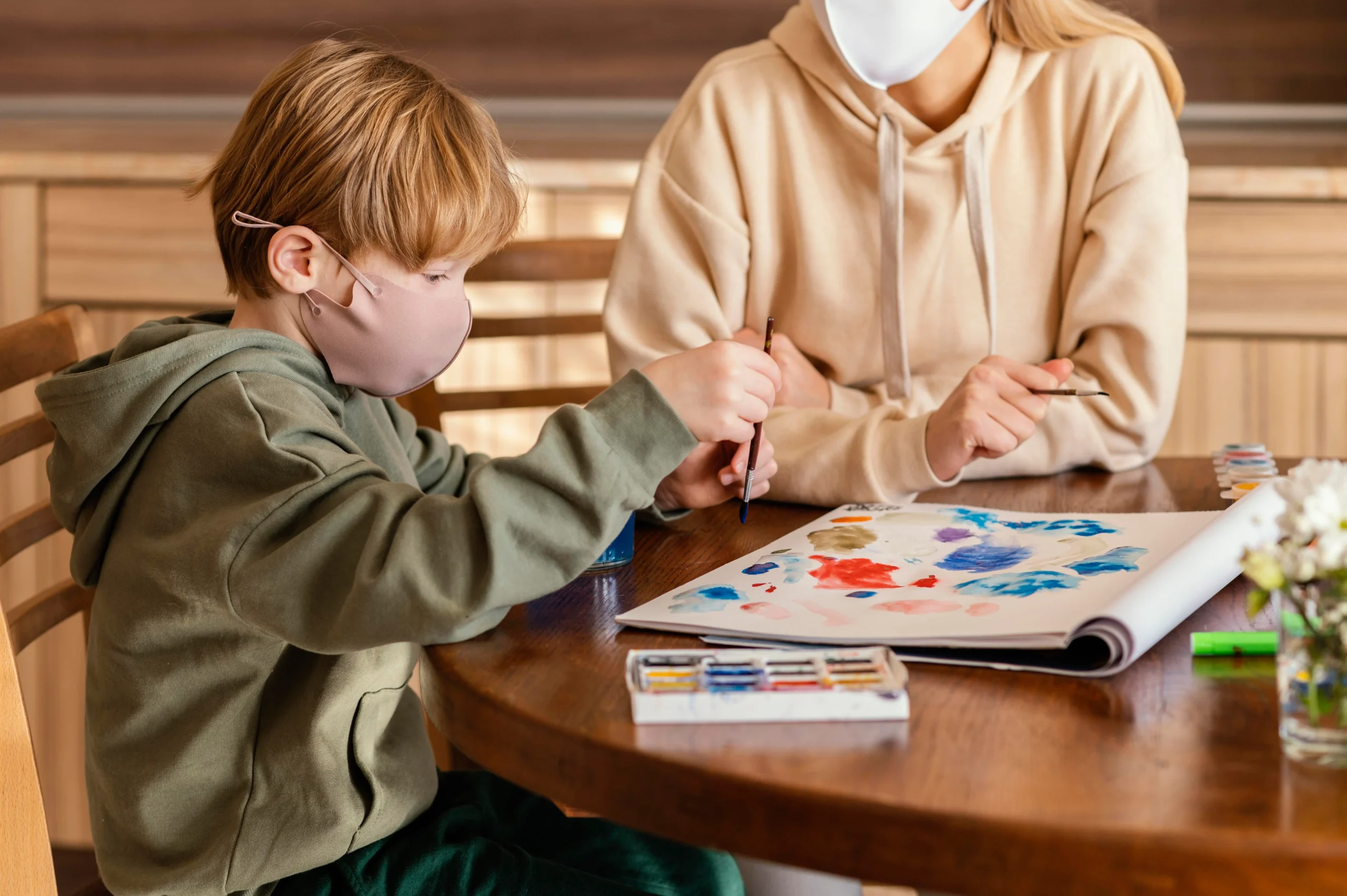 close-up-kid-painting-paper