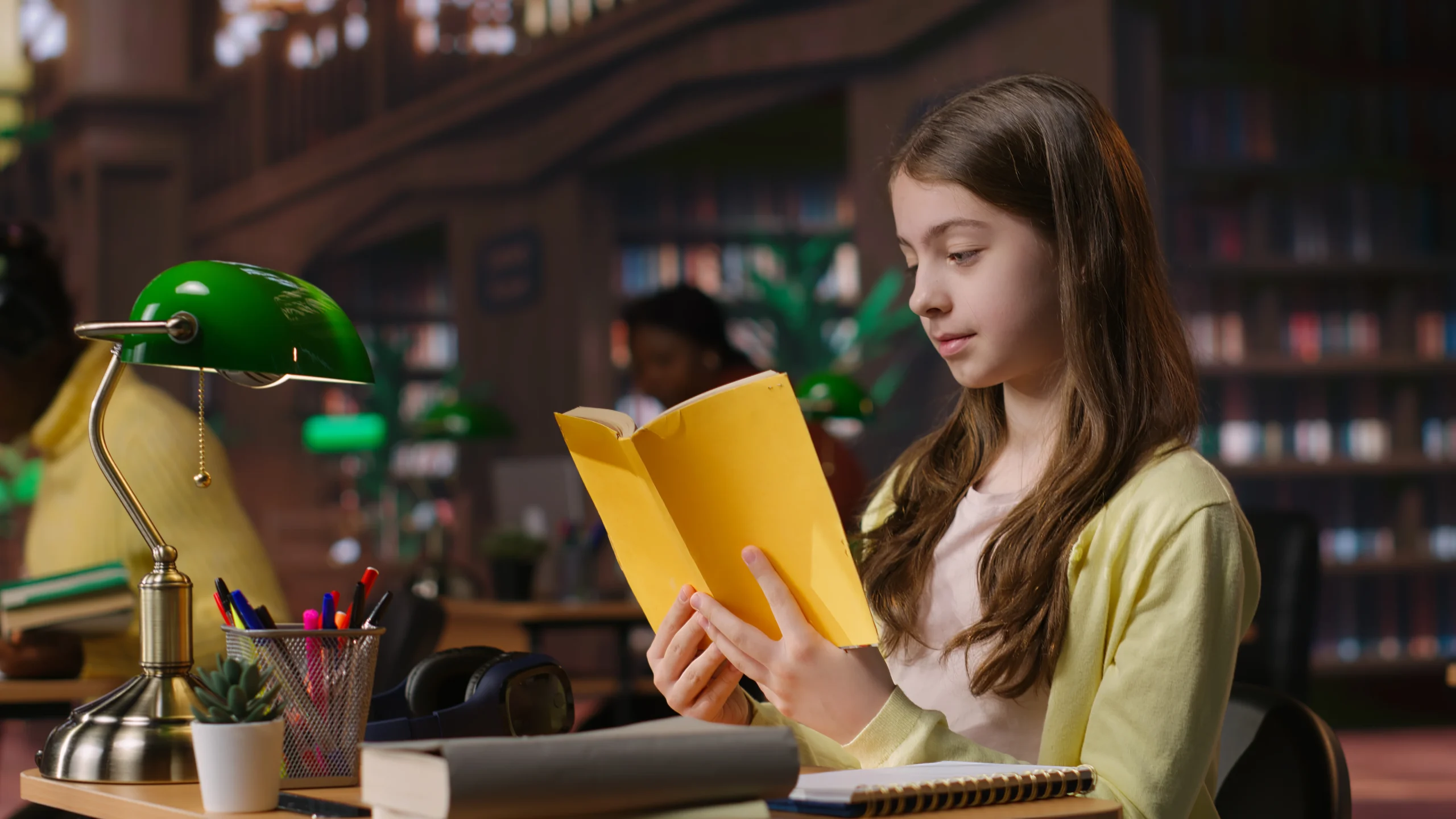 teenager-immersed-reading-literary-works-from-school-library-database